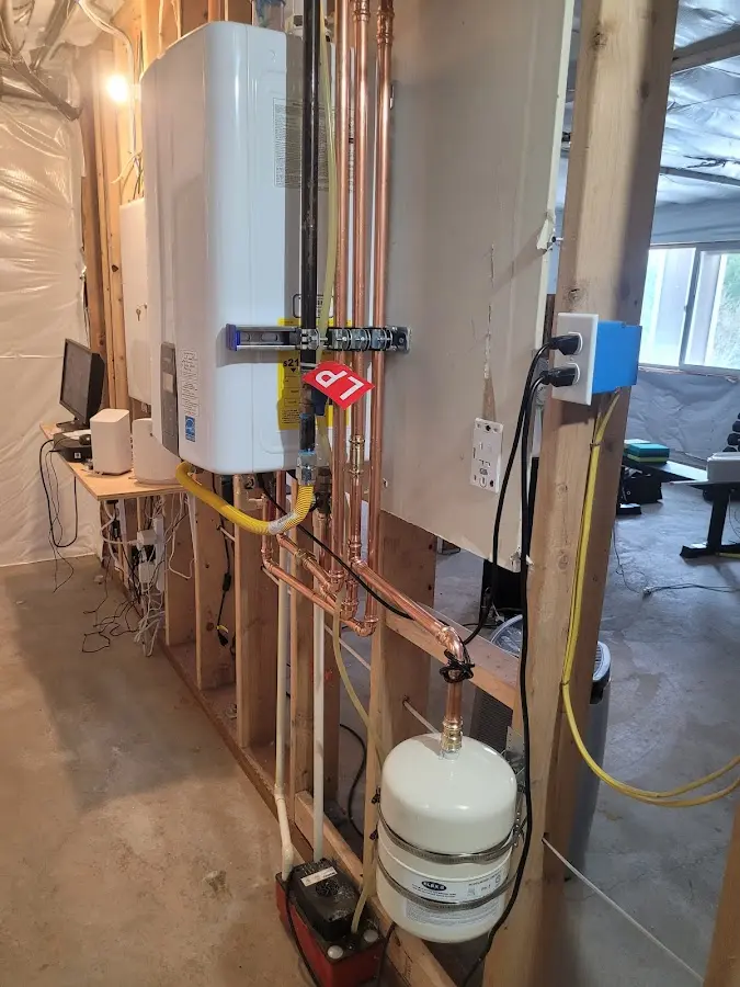 Licensed plumber repairing a kitchen sink in Beaver Dam